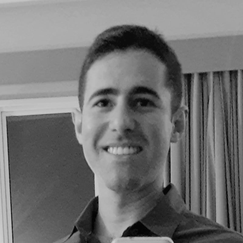 Professional headshot of Erion Criscente, Full Stack Developer specializing in React, Python, JavaScript, Django, Next.js, Docker, Serverless, and AWS cloud solutions